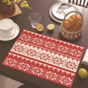 Detail of red and white Nordic snowflake pattern on heat-resistant Christmas placemat