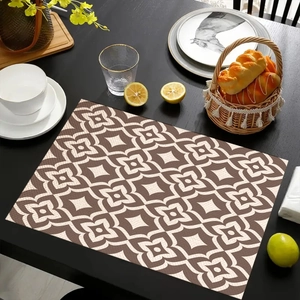 Detail of bohemian retro placemat with geometric floral pattern on a dark wood table