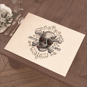 Linen placemat with rocker skull and spitfire design on dark wood table setting