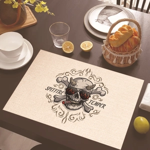 Linen placemat with black skull design and Spitfire text on a dark wooden table