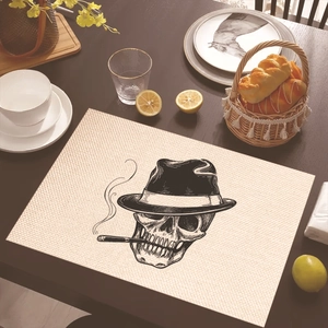 Linen placemat featuring a vintage black skull pattern for dining table decor