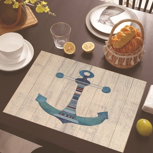 Detail showing cartoon nautical anchor placemat with wood grain on a dining table