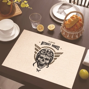 Linen placemat with retro motorcycle skull design on a dark wood dining table