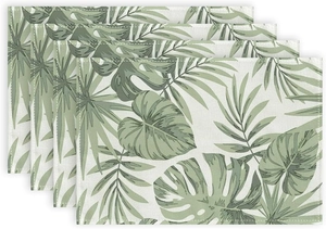 Detailed texture of cotton linen placemats with tropical monstera leaf prints