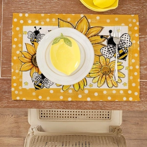 Sunflower and honey bee placemat with yellow polka dot border on wooden table
