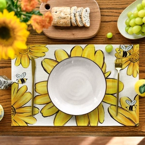 Rectangle sunflower placemat with bee print on a rustic wooden dining table