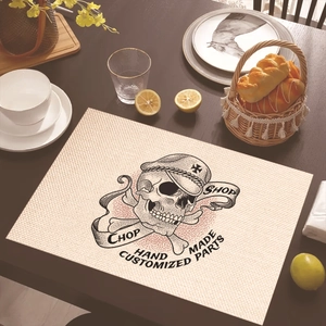 Linen placemat with black skull print and Chop Shop text in a vintage industrial style