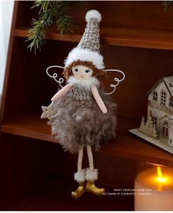Detail showing plush Christmas angel doll with grey knit hat and gold star ornament