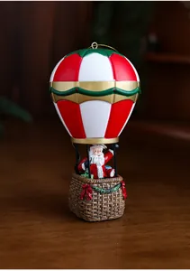 Macro shot of resin Santa Claus hot air balloon with detailed texture and festive colors