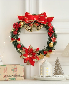 Détail d'une couronne de Noël de 30 cm avec nœud rouge, cloches d'or et lumières LED