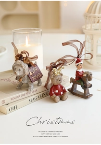 Detail of resin Christmas ornaments featuring a dog, bear, and boy with silk ribbons
