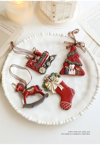 Set of 4 vintage resin Christmas ornaments including train and tree in a white tray