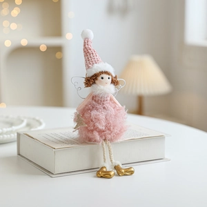Pink plush angel girl doll with wings holding a gold star for Christmas tree decoration