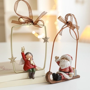 Vintage style resin Christmas ornaments featuring Santa and angel in metal frames