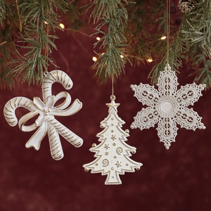 Three-piece white and gold Christmas ornaments including snowflake, tree, and candy cane