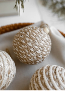 Detailed macro view of 8cm woven hemp and cotton rope ball with rustic spiral texture