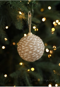 Close-up of 8cm rustic hemp and cotton rope woven Christmas ornament with a wooden bead