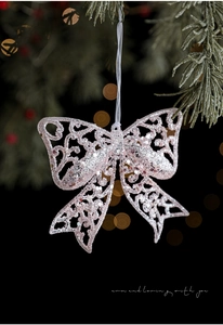 Pink glitter butterfly ornament with hollow design on Christmas tree branches
