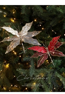 Detailed view of mesh butterfly Christmas ornaments with gold glitter on a festive tree