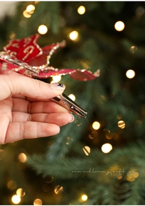 Detail of red mesh butterfly clip for Christmas decor with silver glitter finish