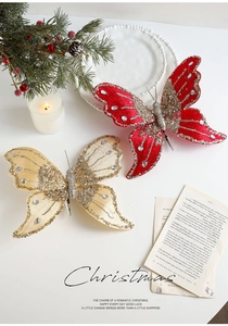 Detail of red and champagne velvet butterfly clips with glitter and rhinestones for Christmas