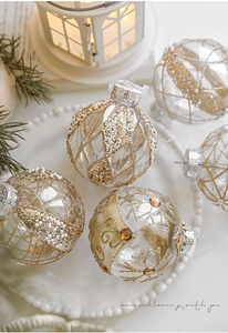 Detail of 8cm clear Christmas ball ornaments with gold glitter mesh and white beads