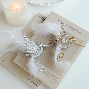 Glittering hummingbird ornaments with white feathers and rhinestones for Christmas trees