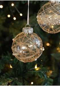 Detail of 8cm clear Christmas ball with gold glitter grid and faux pearls on tree