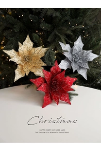 Detailed view of red, gold, and silver glitter poinsettia flowers for Christmas decor