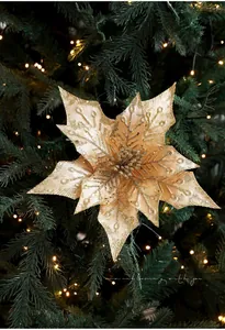 Close-up of a 29cm glittery gold artificial poinsettia flower for Christmas tree decoration