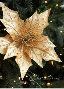 Macro shot of champagne gold glitter Christmas poinsettia with shimmering sequins