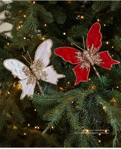 Details von roten und weißen Samt-Weihnachtsschmetterlings-Clips mit Goldpailletten
