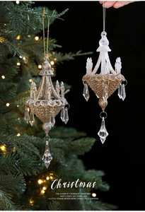 Detail of Christmas chandelier ornaments with gold glitter and acrylic crystal drops