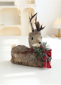 Macro detail of handmade sisal reindeer decor with festive red plaid bow and pine cones