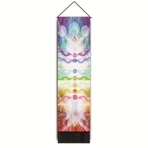 Detailed shot of vertical Chakra wall tapestry with sacred symbols and black tassels