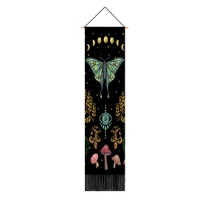 Vertical wall tapestry with moon phases, moth, and mushrooms on black fabric with fringe