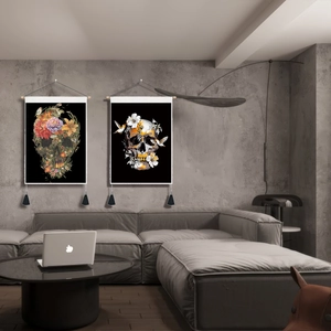 Artistic skull tapestry with flowers and birds on wall above grey sofa