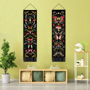Set of two black tapestries featuring colorful mushrooms, butterflies, moon phases and tassels