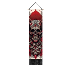 Detailed skull art tapestry with wood hanging rod and black decorative tassels on a white wall