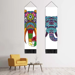 Detail of bohemian elephant tapestries featuring vibrant prints and black fringe tassels