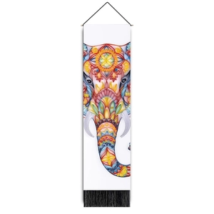 Detail of bohemian elephant tapestry with colorful mandala patterns and black tassels