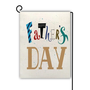Close-up of textured linen Father's Day garden flag with colorful printed lettering