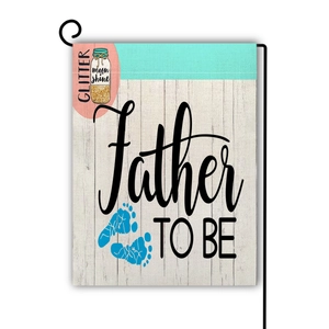 Detail of Father To Be garden flag on a black metal stand with blue baby footprints