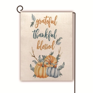 Close-up of linen garden flag with pumpkins and grateful thankful blessed script