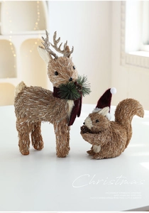 Detail of sisal elk and squirrel figurines with red scarves for Christmas decor