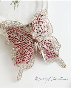 Vue détaillée du nœud à paillettes champagne avec clip en métal pour décor de sapin de Noël