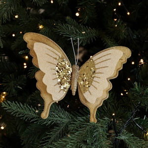 Ornamento farfalla in velluto dorato a doppio strato con paillettes su un albero di Natale