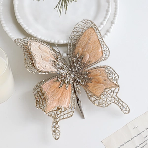 Pince papillon champagne en velours avec paillettes dorées pour décor de sapin