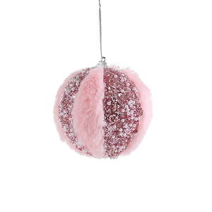 Pink plush Christmas ball with sequins and white pearls hanging on a white background