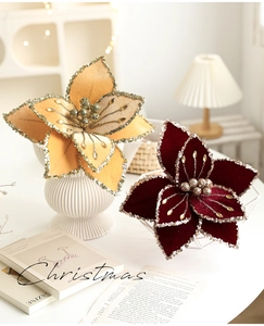 Detail of red and gold Christmas fabric flowers with sequins and rhinestone centers